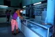A man waits in an almost empty pharmacy amid the Covid-19 pa
