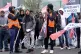 JUST PAY NOW: (Below) Amazon staff members on a GMB picket l