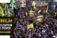 Hezbollah members carry the coffins of two of their comrades