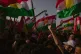 Kurds waving the flag of the Kurdistan Region in Erbil