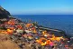 Life jackets are strewn across a Mediterranean beach