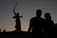 A couple look at The Motherland Calls, a monument to the Sov