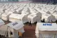 Earthquake survivors arrive yesterday at the camp setup by t