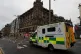 An ambulance drives along Prince Street, Edinburgh