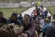 People receive food from a church in the town of Borodyanka,