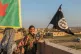 Women YPJ fighters take down the last Isis flag replacing it